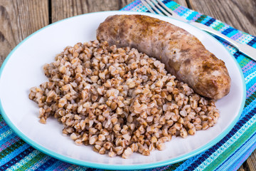 Fried sausage with buckwheat