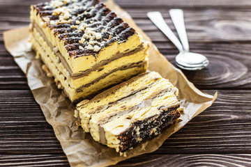 Ice cream pistachio cake with chocolate on wooden background