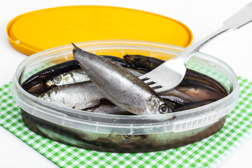 Salted sprats in plastic jar