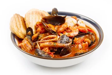 fresh seafood soup with roasted bread © Lsantilli