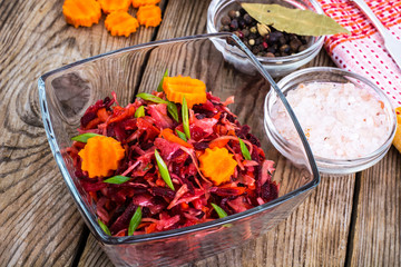 Vegetable salad with carrots, beets, cabbage and onions