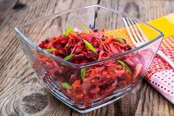 Vegetable salad with carrots, beets, cabbage and onions
