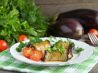 Baked stuffed eggplant with meat, vegetables and cheese.