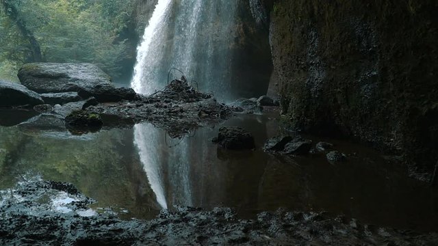Slow motion video of reflection of the Haew Suwat Waterfall. Famous 20 meter waterfall from Leonardo DiCaprio's The Beach

