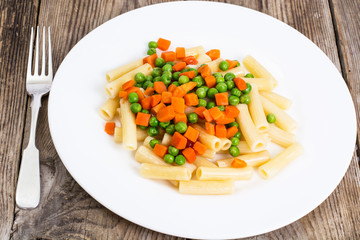 Rigatoni Pasta with vegetables in white plate