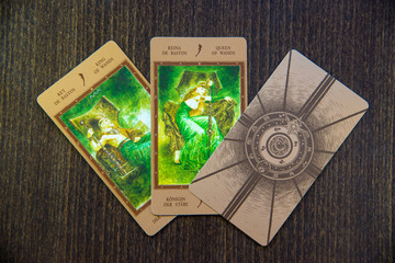 Tarot cards on the wood. Labirinth tarot deck. Esoteric background.