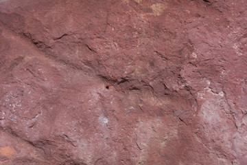 Textured surface of colorful rock