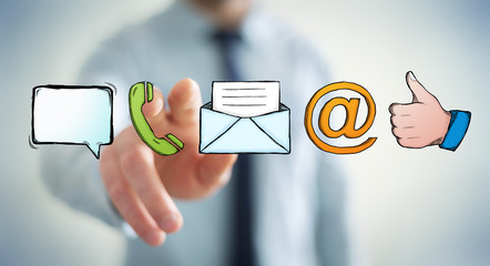 Businessman touching manuscript contact icon with his finger