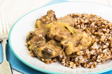 Meat with gravy, buckwheat