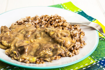 Meat with gravy, buckwheat