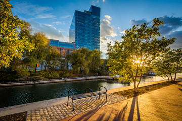 The Waterfront Promenade and modern building at sunset, in Harbor East, Baltimore, Maryland.