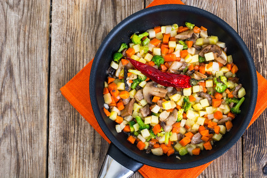 Vegetables with mushrooms, cooked in frying pan