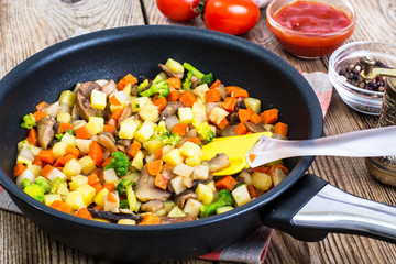 Vegetables with mushrooms, cooked in frying pan