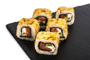Original sushi rolls on black stone