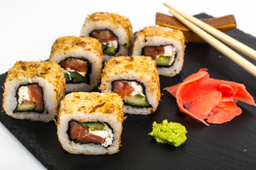 Original sushi rolls on black stone