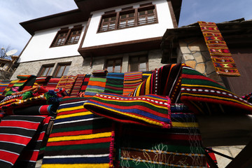 Colorful rug in the Rhodope village of Shiroka Luka, Bulgaria © georgidimitrov70