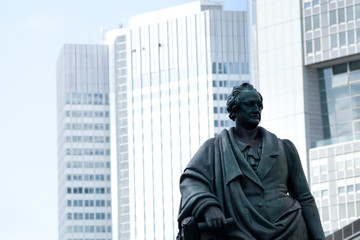 Goethe statue at Goetheplatz in Frankfurt with skyscraper