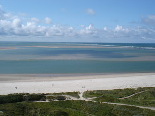 Windy Blavand beach with blue sky and clouds in Denmark