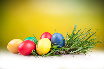 Easter colored eggs in the grass