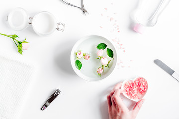 salt and cream for nail care in spa top view