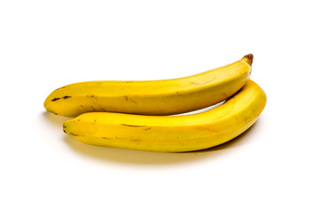 Two yellow bananas on a white background. Not isolated.