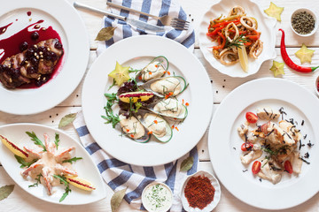 Buffet of luxurious mediterranean snacks flat lay. Top view on restaurant table with assortment of seafood meals. Banquet, menu, expensive food, success concept