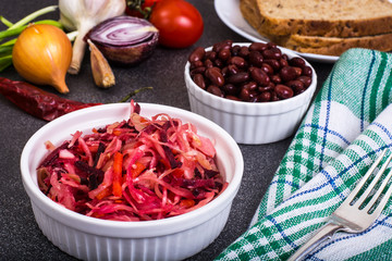 Salad of raw vegetables, red beans, bread