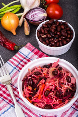 Salad of raw vegetables, red beans, bread