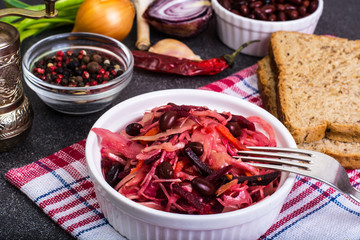 Salad of raw vegetables, red beans, bread