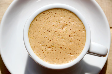 Obraz premium Cup of coffee view fom top