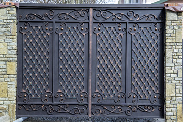magnificent wrought-iron gates, ornamental forging, forged elements close-up