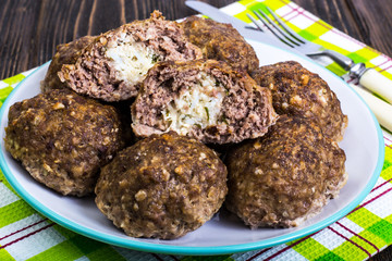Meatballs stuffed with cheese and boiled egg