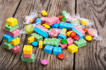 Original candy to children on the wooden background