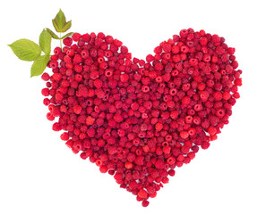 Fototapeta na wymiar heart shape of fresh sweet raspberries isolated on white