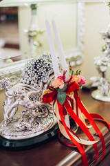 Beautiful set of women's wedding accessories. Bride's morning. White shoes jewelry and candles.