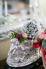 Wedding buttonhole  bouquets of white and red flowers peonies on background.