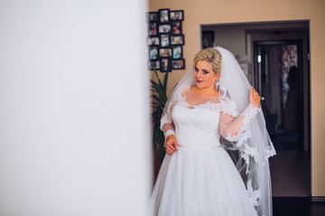 young bride portrait with perfume is getting ready at home in the morning, wedding day