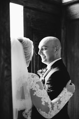 Young beautiful bride and groom near old door . Wedding day. Wedding session