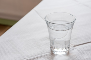 Glass of water, on the table.