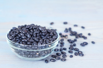 Fototapeta na wymiar Black beans in glass bowl. Healthy food.
