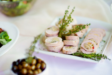 Delicious pork rolls with vegetables served on a party or wedding reception