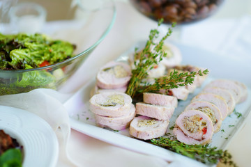 Delicious pork rolls with vegetables served on a party or wedding reception