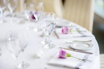 Beautiful table setting with crockery and flowers for a party, wedding reception or other festive event