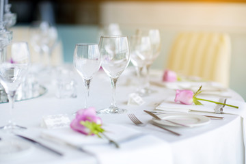 Beautiful table setting with crockery and flowers for a party, wedding reception or other festive event