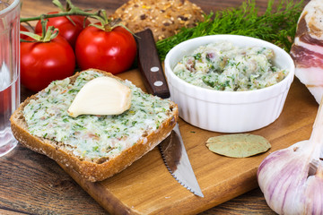 Appetizer of chopped bacon with garlic and herbs