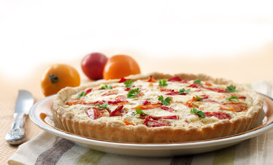 Tart with salted sheep cheese and tomatoes