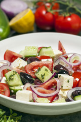 Greek Salad with Ingredients Behind