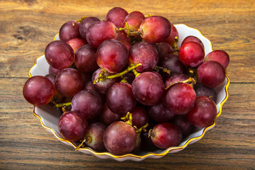 Sweet red grapes in a bowl