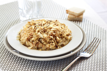 Fried cabbage with caraway and garlic on a plate