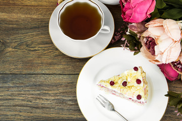 Piece of sponge cake with berries and cream